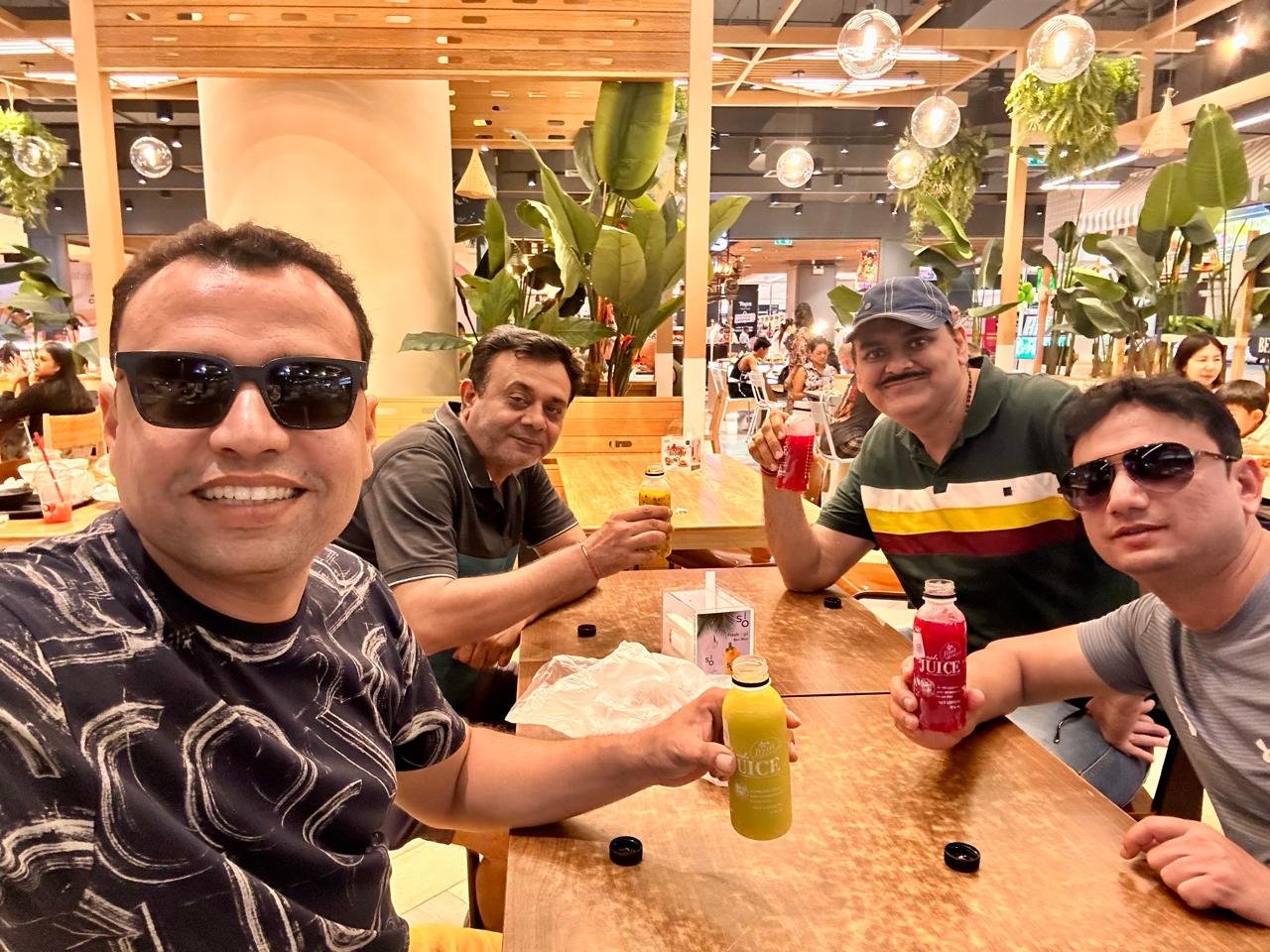 Group of people sitting at a table in a restaurant