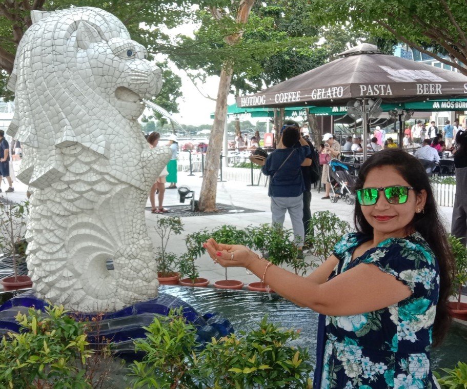 Person standing in front of a waterfall